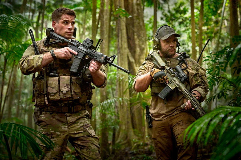 (L-R) Liam Hemsworth as Kinney and Luke Hemsworth as Abel in the action film, LAND OF BAD, a release by The Avenue. Photo courtesy of The Avenue.  
