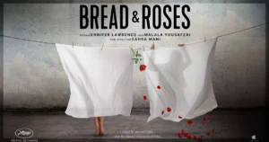 This is a banner for a review of the documentary Bread & Roses.
