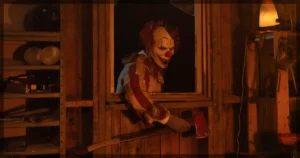 This is a banner for a review of the horror film Clown in a Cornfield.
