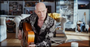 This is a banner for a review of the documentary Strange Journey: The Story of Rocky Horror.