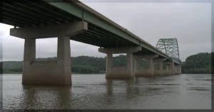 This is a banner for a review of the documentary Eight Bridges. Image courtesy of the filmmakers.